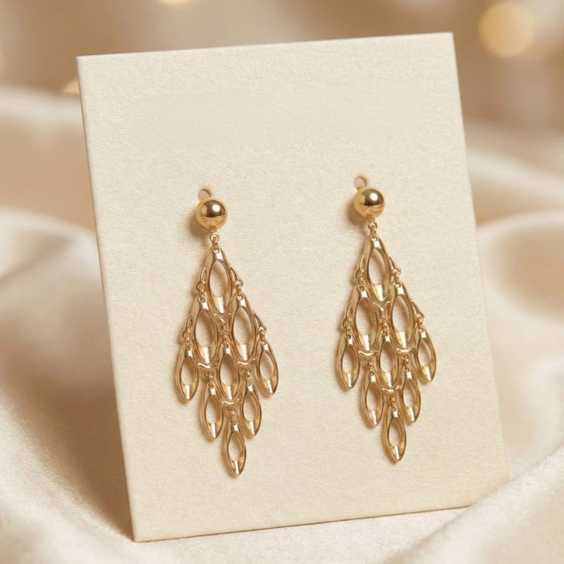 Long gold earrings with a geometric, openwork design, featuring movable charms that sway with your movements, creating a captivating sparkle. A luxurious and modern piece that will turn heads. - Image 4